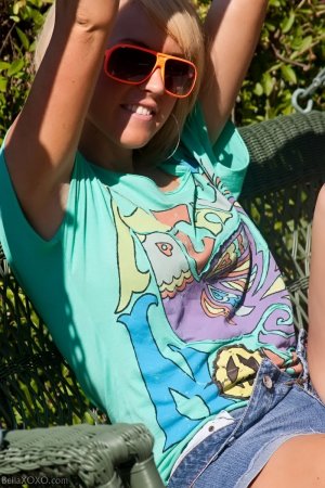 Bella XoXO – Wearing just sunglasses outside photo 1